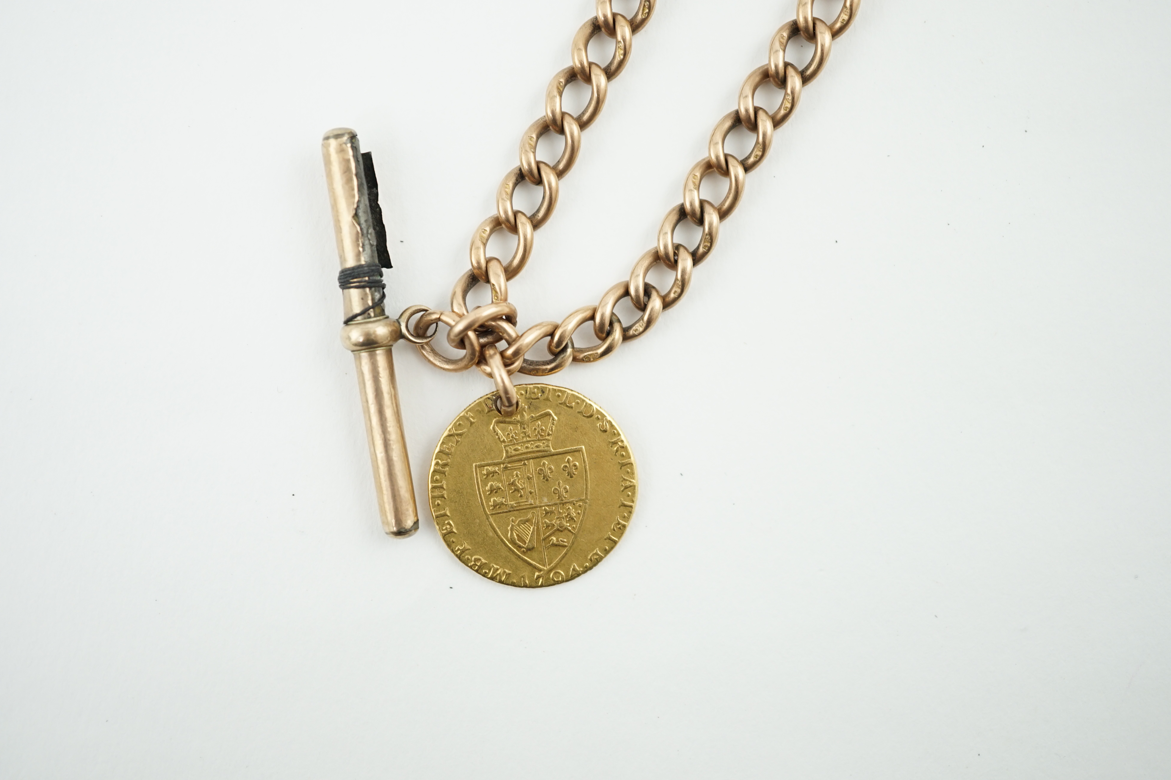 A 9ct gold albert, with gold plated T-bar and hung with a George III 1794 gold spade guinea